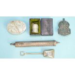 An S Mordan & Co. silver-cased push-pencil (thumb piece missing), a shovel-shaped silver spoon, a