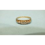 A five-stone diamond ring, the old brilliant-cut diamonds in 18ct gold mount, size Q, 3.6g.