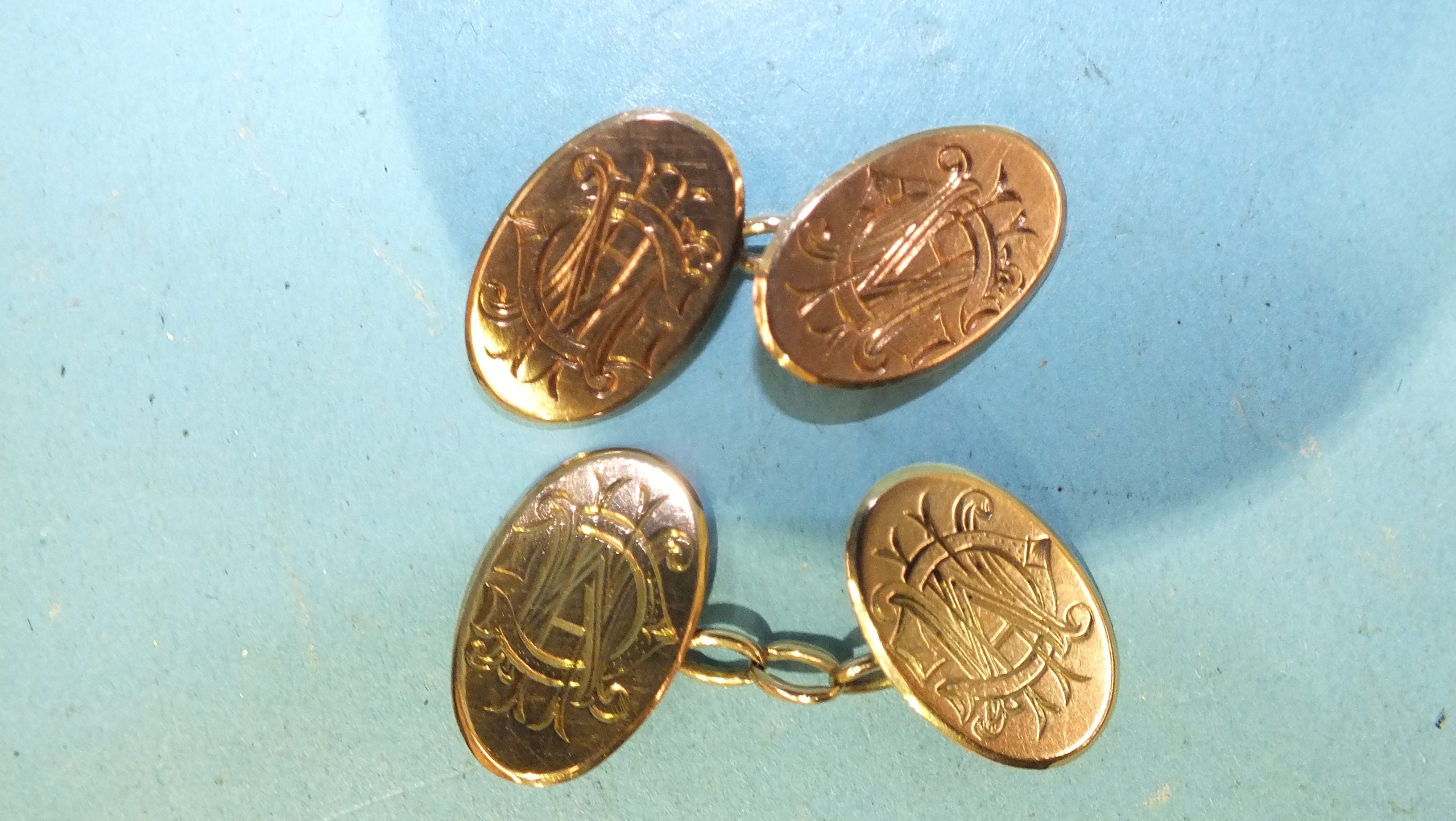 A pair of 9ct gold cufflinks, (monogrammed), 5.6g.