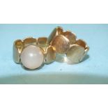 A pair of 9ct gold rings of joined rounded squares, one set a moonstone, sizes N and P, 11.2g.