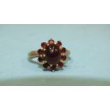 A 9ct gold ring set garnet cluster, size L, 4.3g.