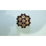 A 9ct gold sapphire and diamond flower head cluster ring, size T, 5g, Birmingham 1981.