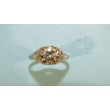 An Art Deco solitaire diamond ring claw-set a brilliant-cut diamond of approximately 0.6cts, between