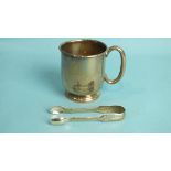 A silver christening mug of plain form, 7.5cm high, Sheffield 1938, ___3.5oz, inscription and a pair
