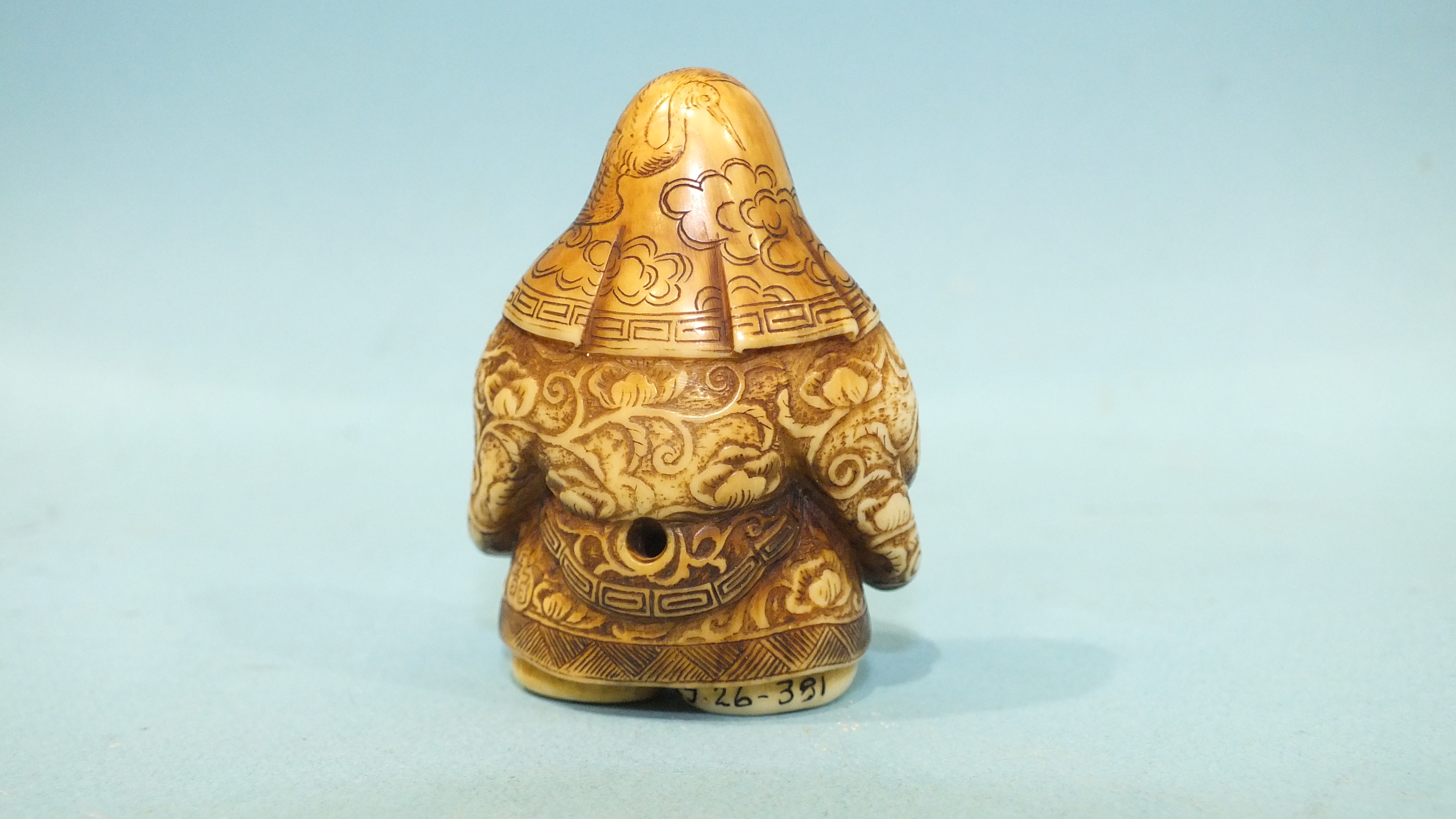 A mid to late-19th century ivory netsuke of Jurojin holding a fan and a tama, his robes finely- - Image 3 of 5