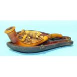 A small meerschaum cheroot holder carved with a fox and rabbit, 13cm long, in case and another