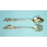 A pair of Dutch salad servers with figural tops, 23cm high, London import marks.