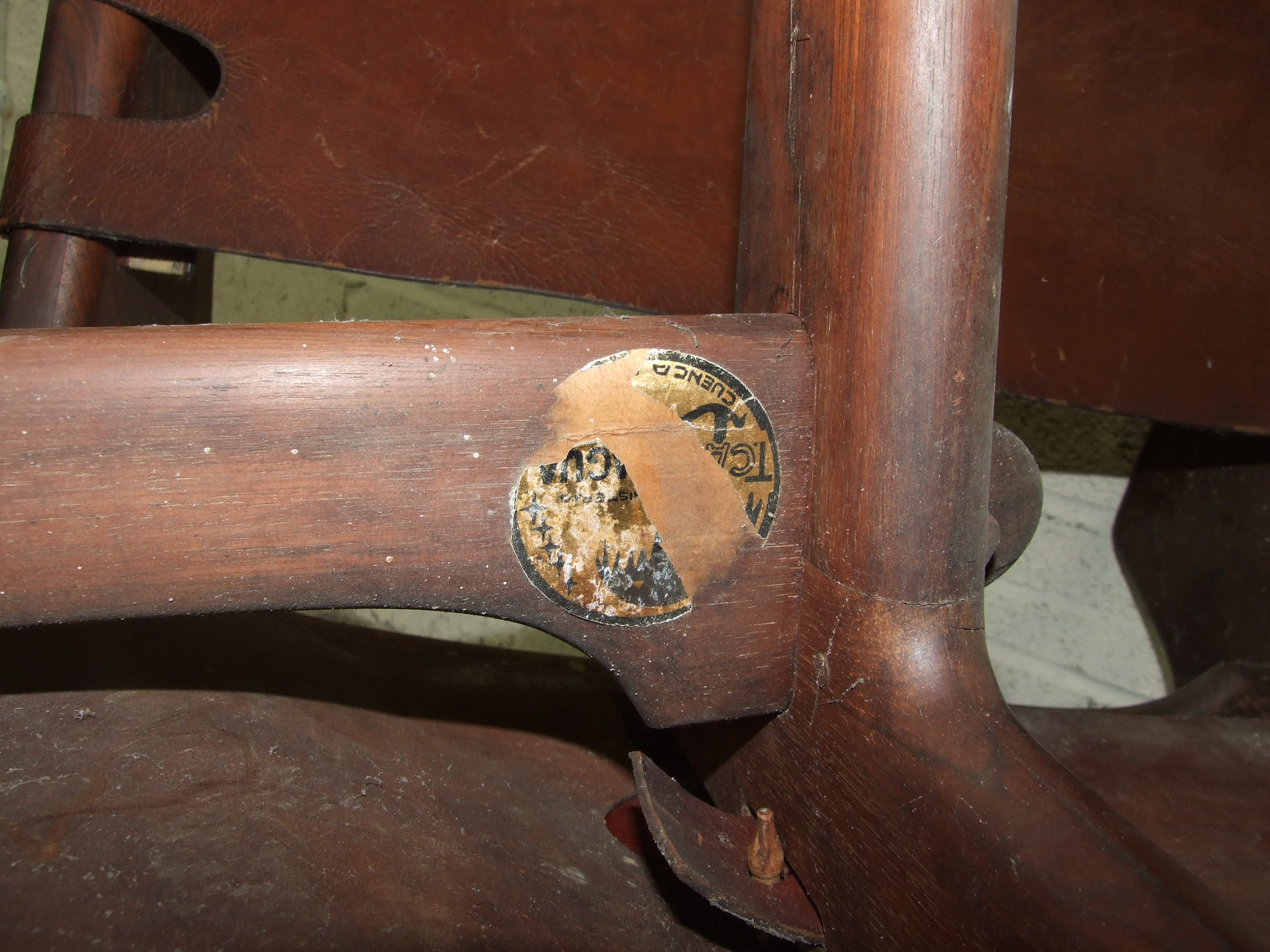 A mid-20th century South American hardwood low chair with leather back and seat, a similar chair - Image 3 of 3