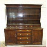 A Georgian oak and mahogany-banded dresser, the associated upper part with moulded cornice above
