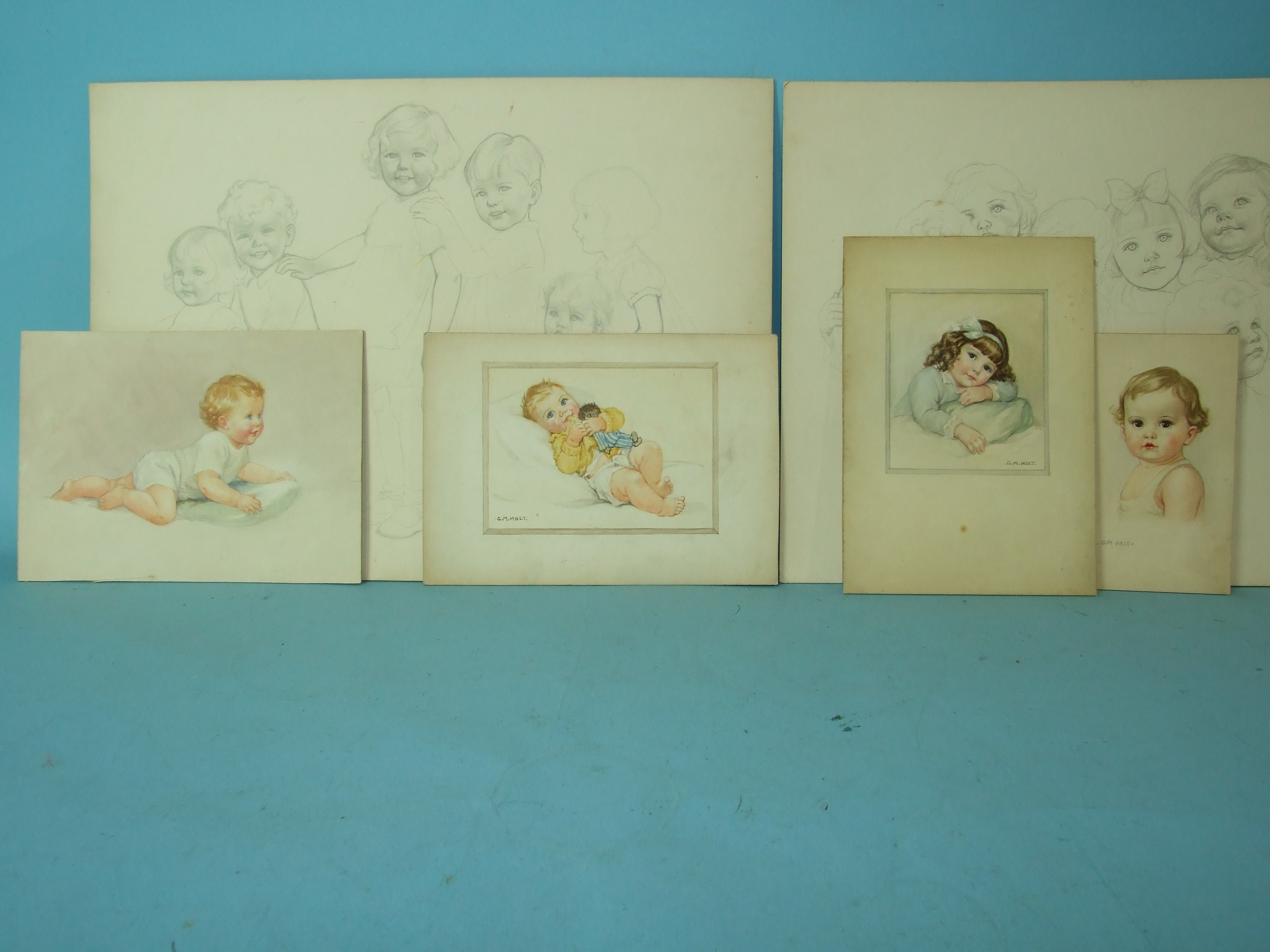 Four original unframed watercolour illustrations of young children, three signed G M Holt, on