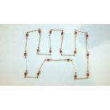A Finnish silver necklace of silver bars interspersed with garnet beads, marked with anvil, 925S and