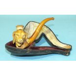 A meerschaum cheroot holder in the form of a sporting dog's head, with amber mouth piece, 12cm long,