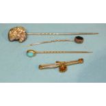 A Victorian stick pin set natural baroque pearl in gold mount, on steel pin, two other stick pins