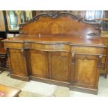 A Victorian mahogany breakfront sideboard with serpentine central drawer and four cupboard doors,