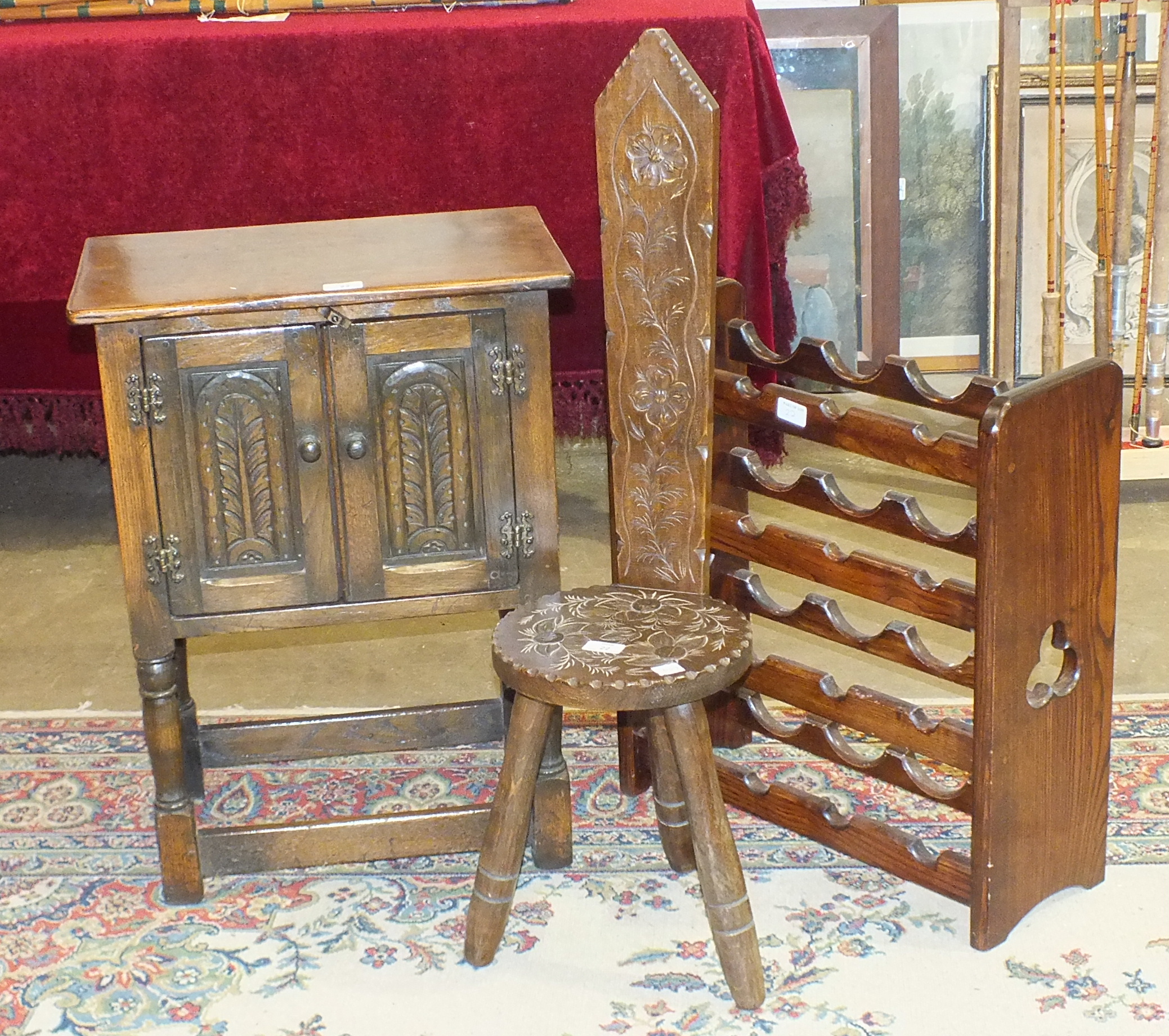 An oak bedside two-door cupboard, 50cn wide, a wine rack and a three-legged milking stool, (3).