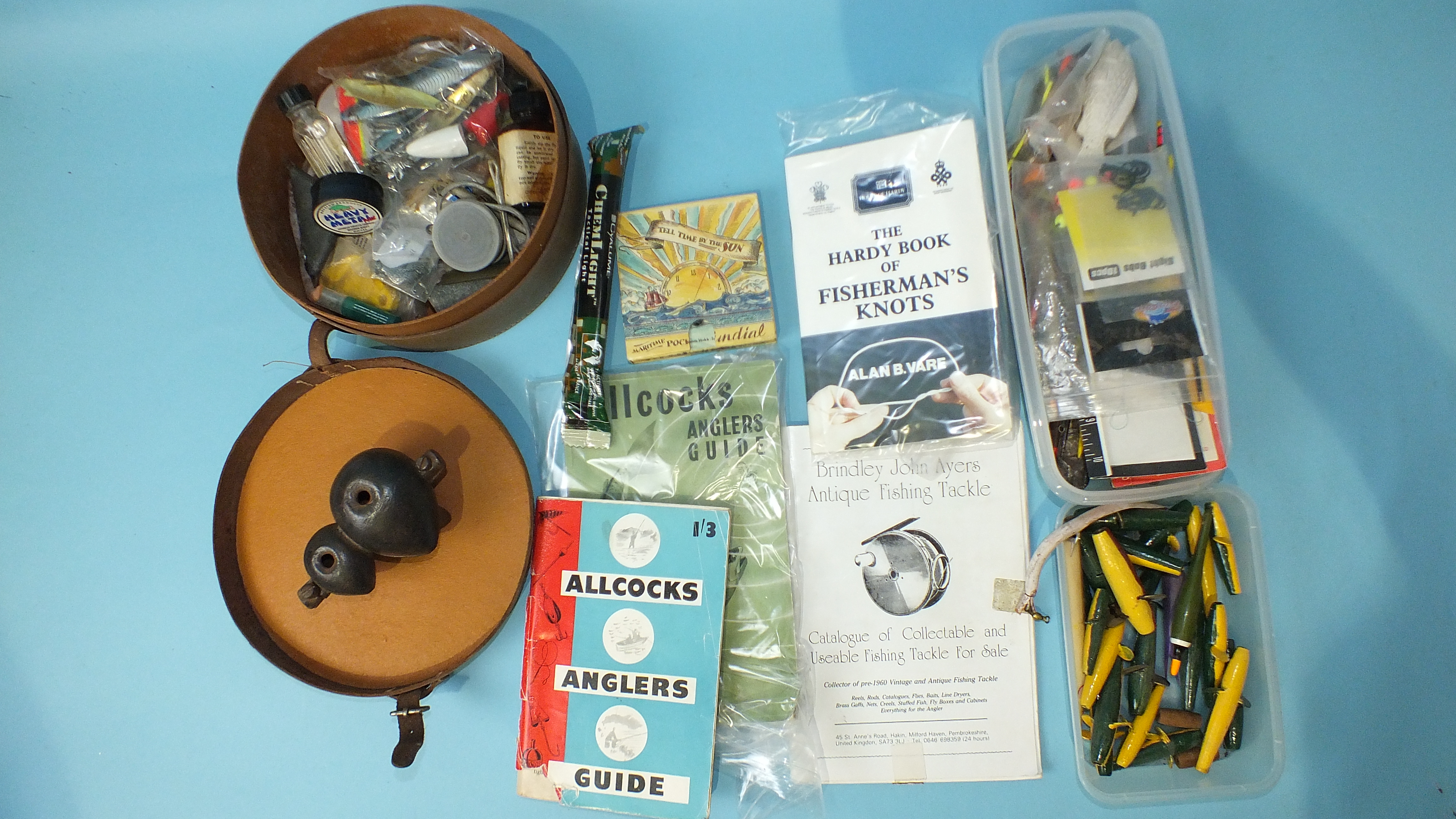 A 1947 Allcocks Anglers' Guide and Catalogue, a cast iron weight mould and miscellaneous fishing