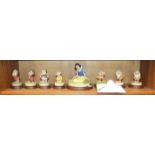 A set of Arden Snow White and the seven dwarfs figurines, boxed with labels.