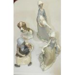 A Lladro figure, girl with goose and puppy, two others, girl with a turkey and girl with a dove