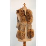 A black rabbit and raccoon fur gilet, labelled, Yu and Me, Paris, and another gilet, rabbit and
