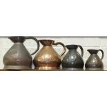 Four copper measuring jugs: quart, half gallon and two gallons, (4).