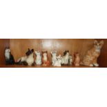 A collection of nine Beswick cat figures and a Winstanley cat model.