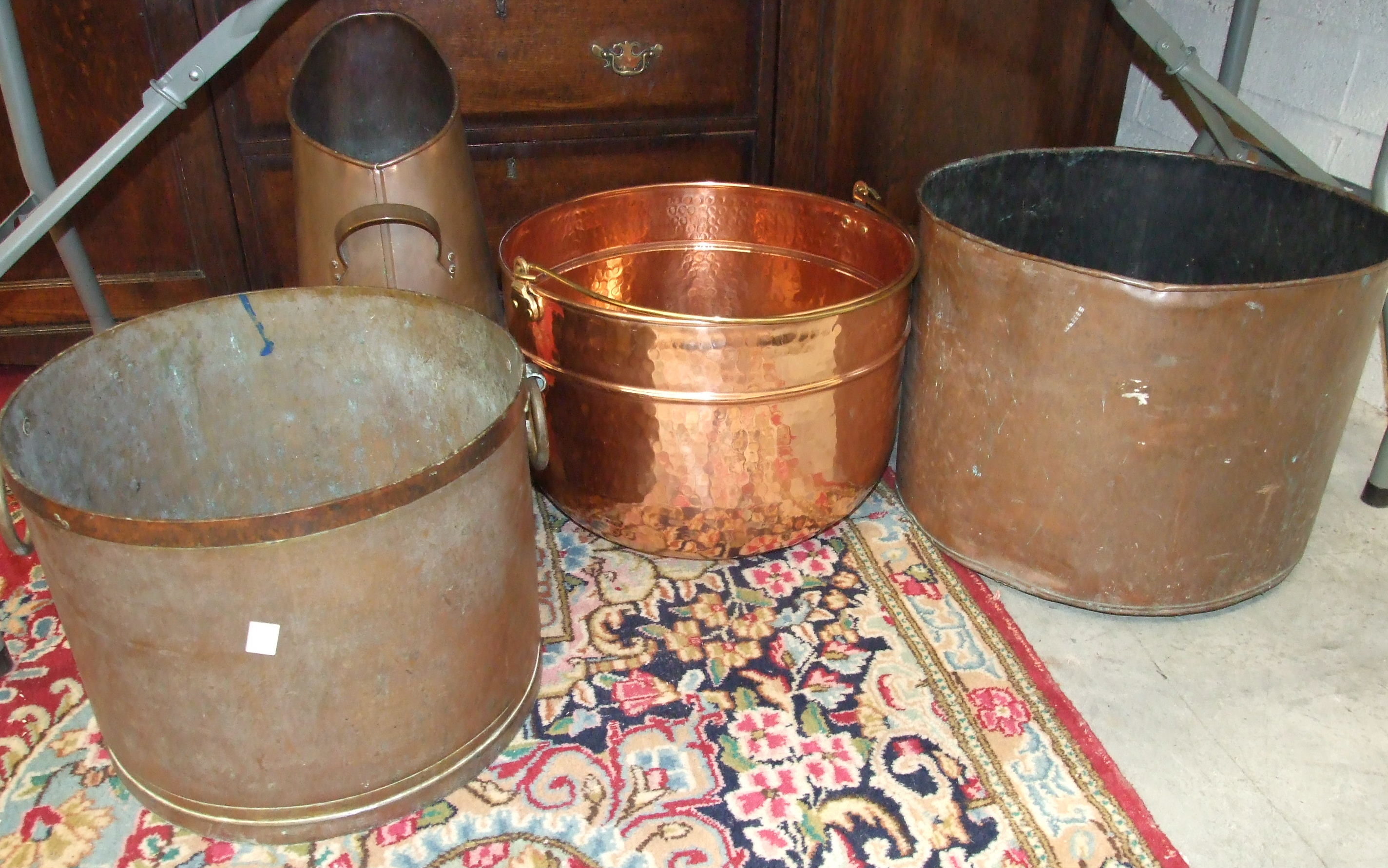 A large copper two-handled circular planter, 40cm diameter and other metalware.