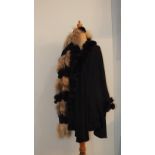 A black acrylic poncho with rabbit trim and a rabbit and marmot scarf, (2).