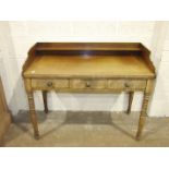 An early-19th century mahogany wash stand, the low back above a later solid top concealing the