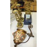 A modern French brass carriage clock, in box, 15cm high, a pair of brass candlesticks and a