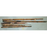 A Milwards Searanger split cane spinning rod and other salt water rods.