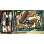 A collection of woodworking and other tools, including planes and brace and bit.