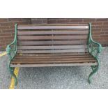 A garden bench with cast iron ends, 126cm and another, similar.