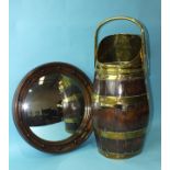 A brass mounted coopered oak coal hod/stick stand, 58cm high and a circular convex mirror, 44cm