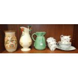 A Charlotte Rhead baluster ribbed vase, (hairline crack), a Clarice Cliff harvest jug and other