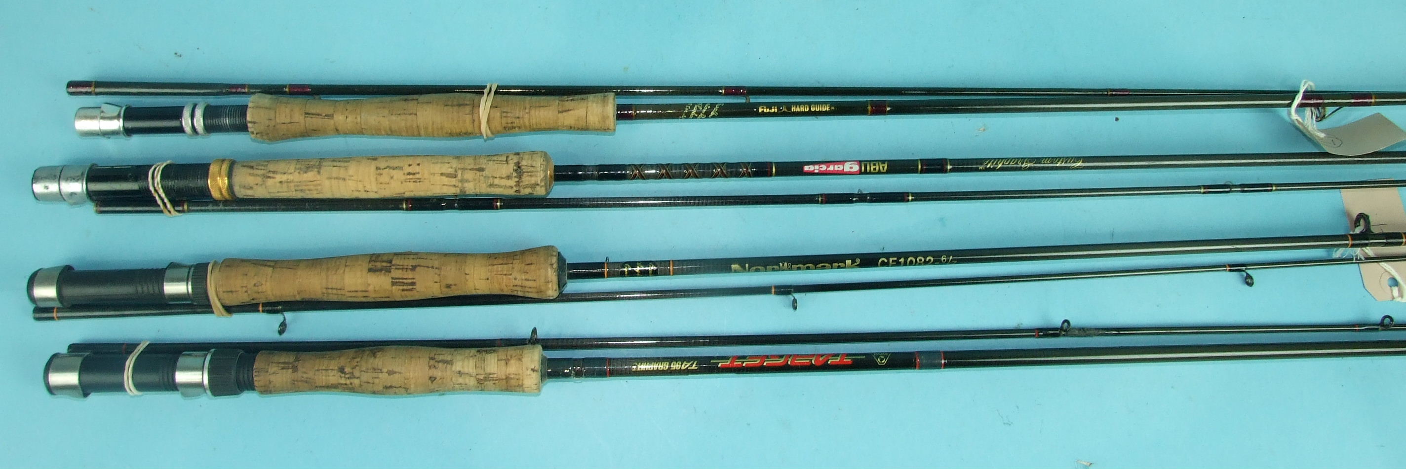 A White River Classic No.6 graphite rod, four other graphite rods, two tubular steel trout rods