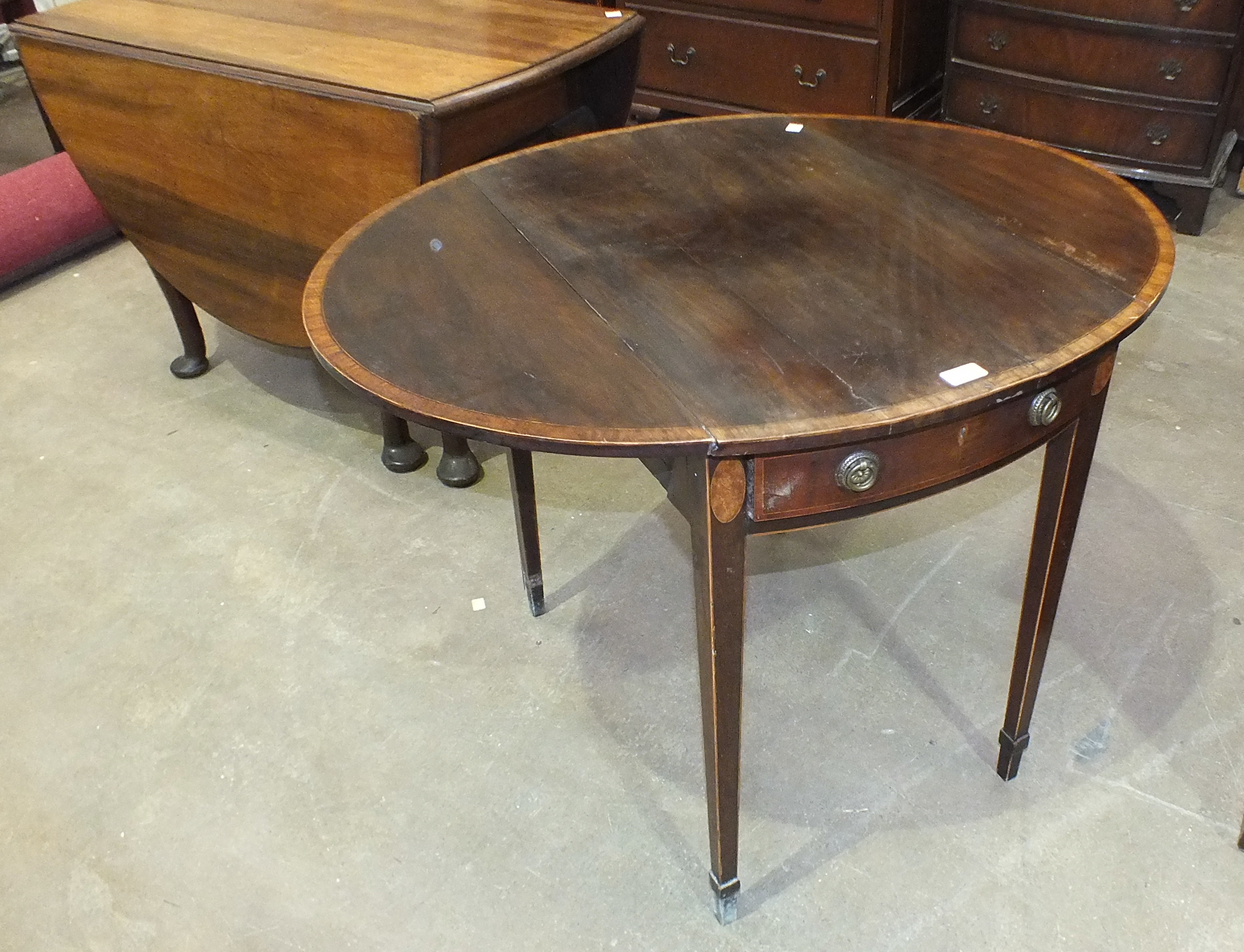 A walnut drop-leaf oval dining table, 105 x 146cm open, a Georgian cross-banded mahogany oval - Image 2 of 3