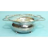 Ramsden & Carr, an Art Nouveau silver circular bowl of hammered form, with six pierced lobes with