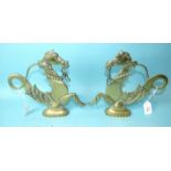 A pair of cast brass gondola finials in the form of sea horses, 23.5cm high, 27cm long, (2).