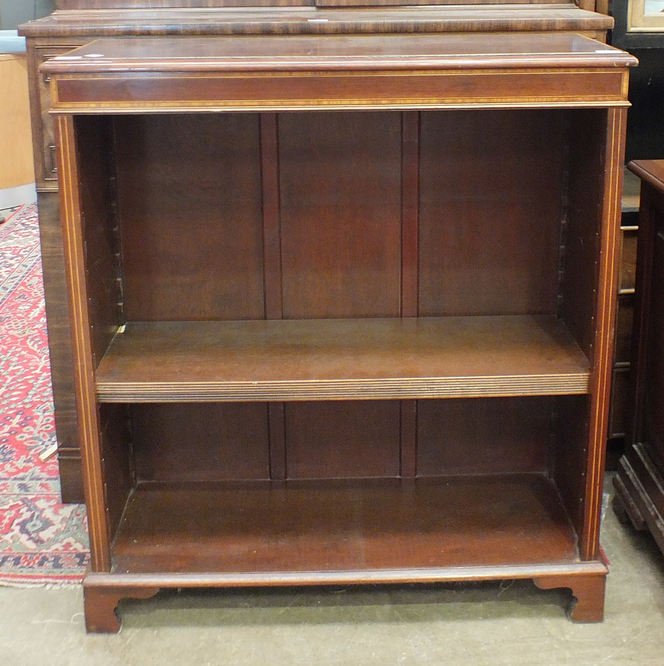 A reproduction mahogany floor standing open bookcase, 92 x 105cm.