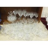 A collection of cut-glass wine and other drinking glasses and other glassware.