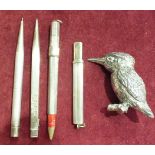 Two silver pencil holders, a silver propelling pencil and other items.