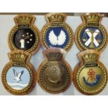 A collection of six modern painted composite ships crests on wood mounts: Talent, Spartan, Torbay (