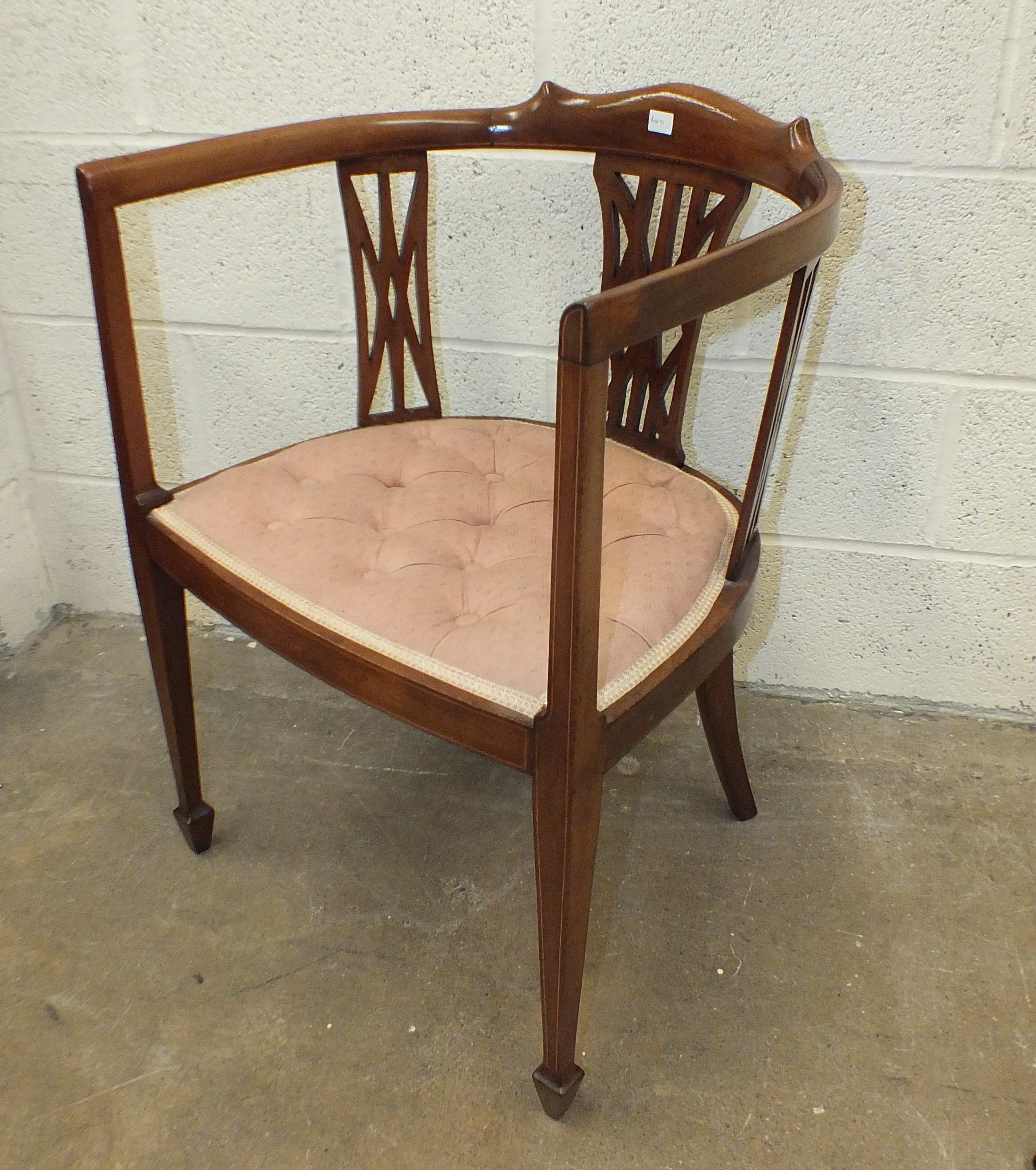 An early 20th century inlaid mahogany tub chair.