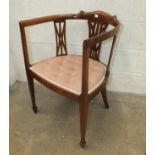 An early 20th century inlaid mahogany tub chair.