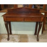 A mahogany hall pier table in the Victorian taste, fitted with two frieze drawers on carved swept