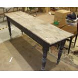 A stained pine narrow kitchen table on turned legs, 53 x 192cm, (in need of restoration) and a