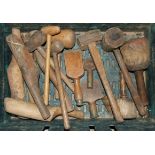 A collection of wood-handled chisels, mauls, lead workers' mallets and other items.