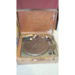 A brass Benares tray on stand, 58.5cm diameter, a portable Collard Microgram record player, a foot