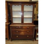 A Victorian mahogany dresser, the moulded cornice above two glazed doors over two short and two long