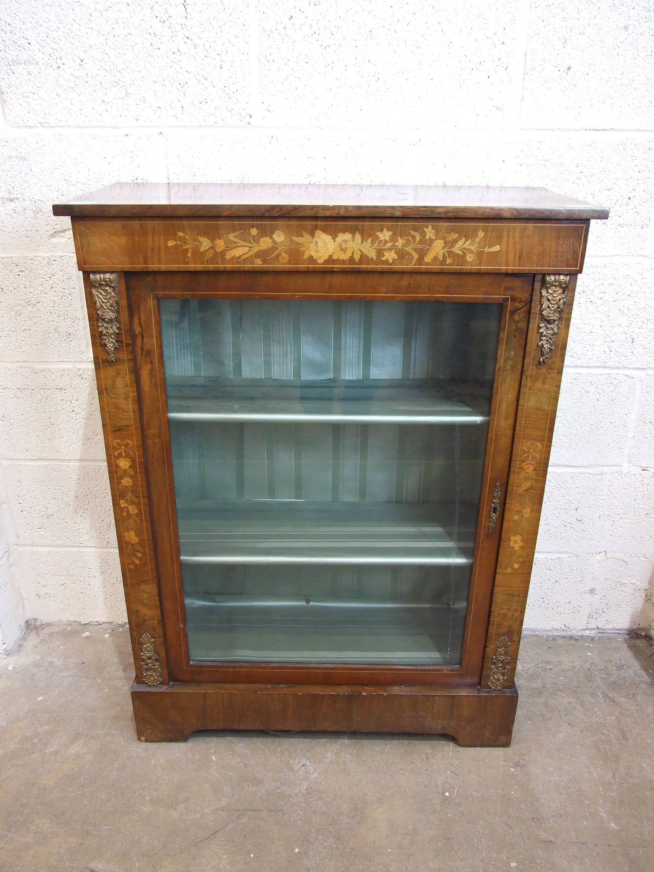 A Victorian walnut and marquetry dwarf bookcase, with single glazed door, 78cm wide, 105cm high.